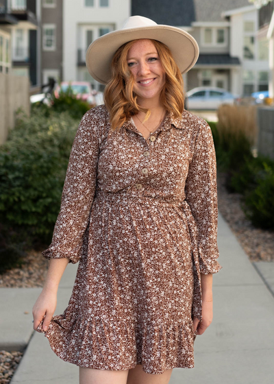 Brown floral dress with buttons on the bodice