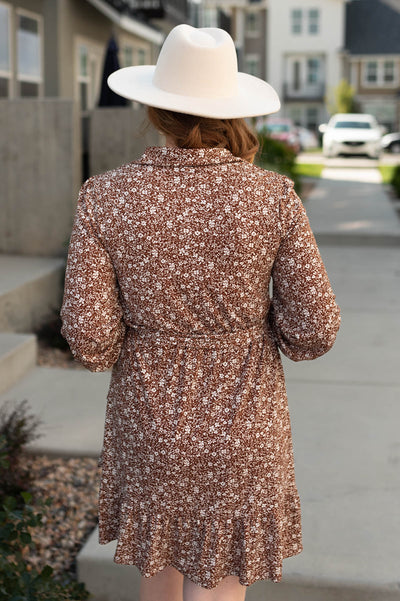 Back view of a brown floral dress