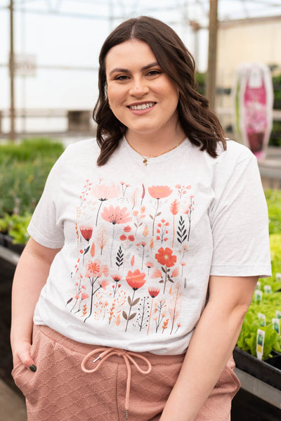 Short sleeve peach and pink wildflower graphic t-shirt in plus size