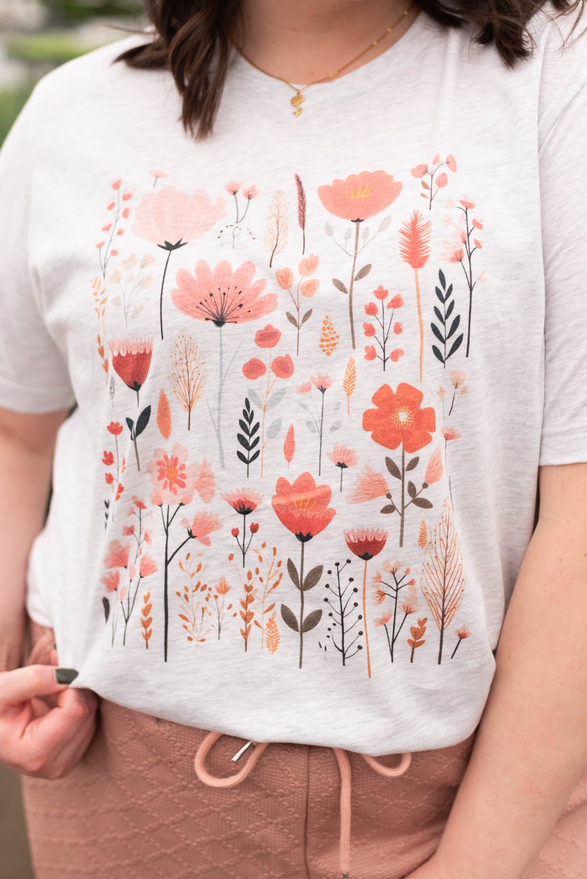 Close up of the graphics on the pick wildflower graphic t-shirt