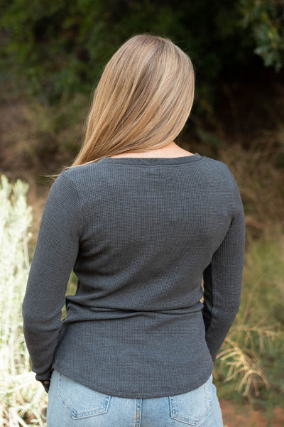 Back view of a charcoal top