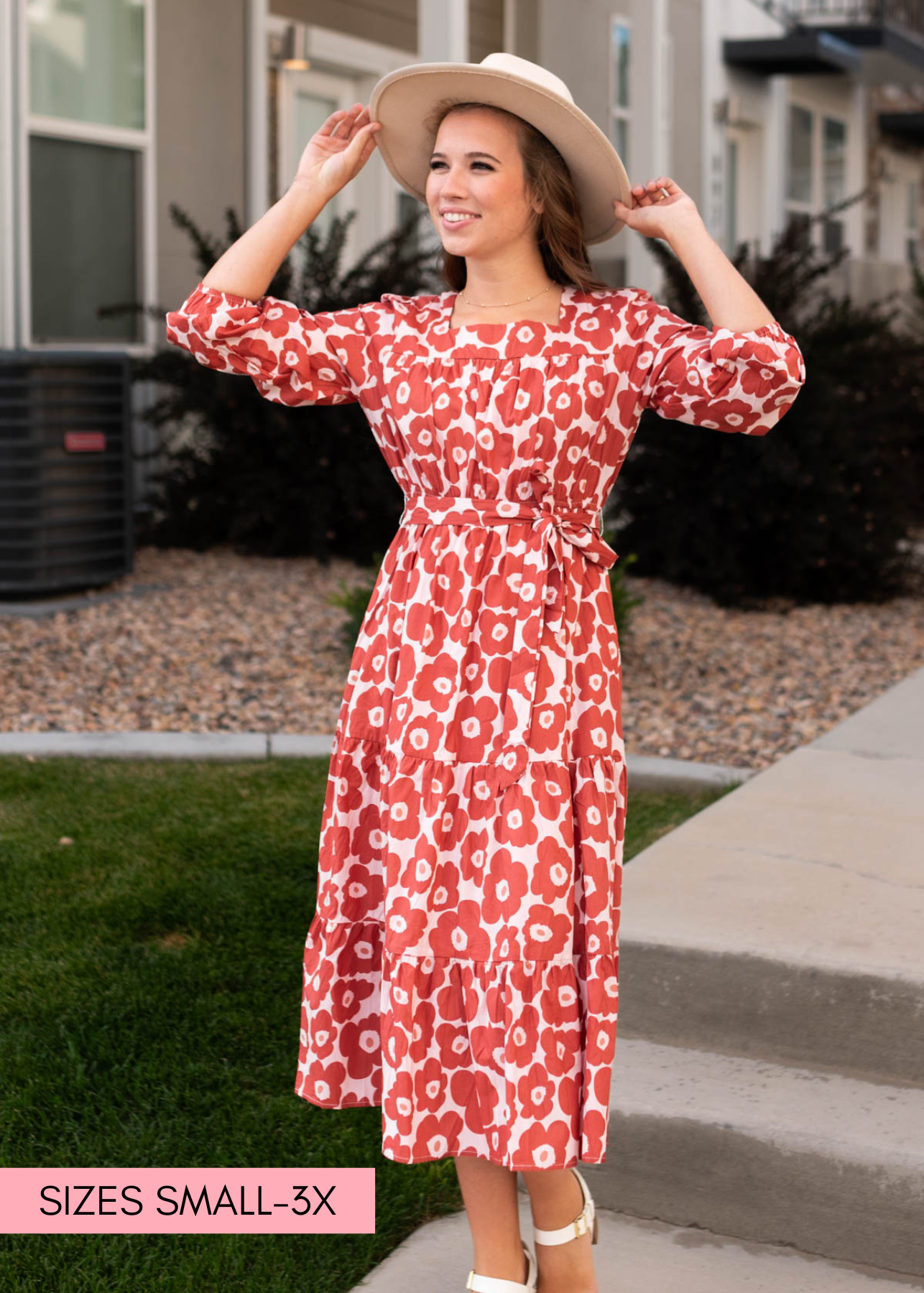 Brick floral dress that ties at the waist and has 3/4 sleeves