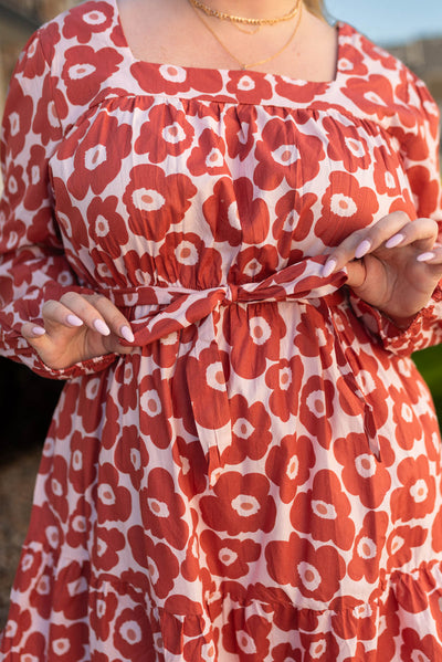 Close up of the floral pattern on a plus size brick floral dress