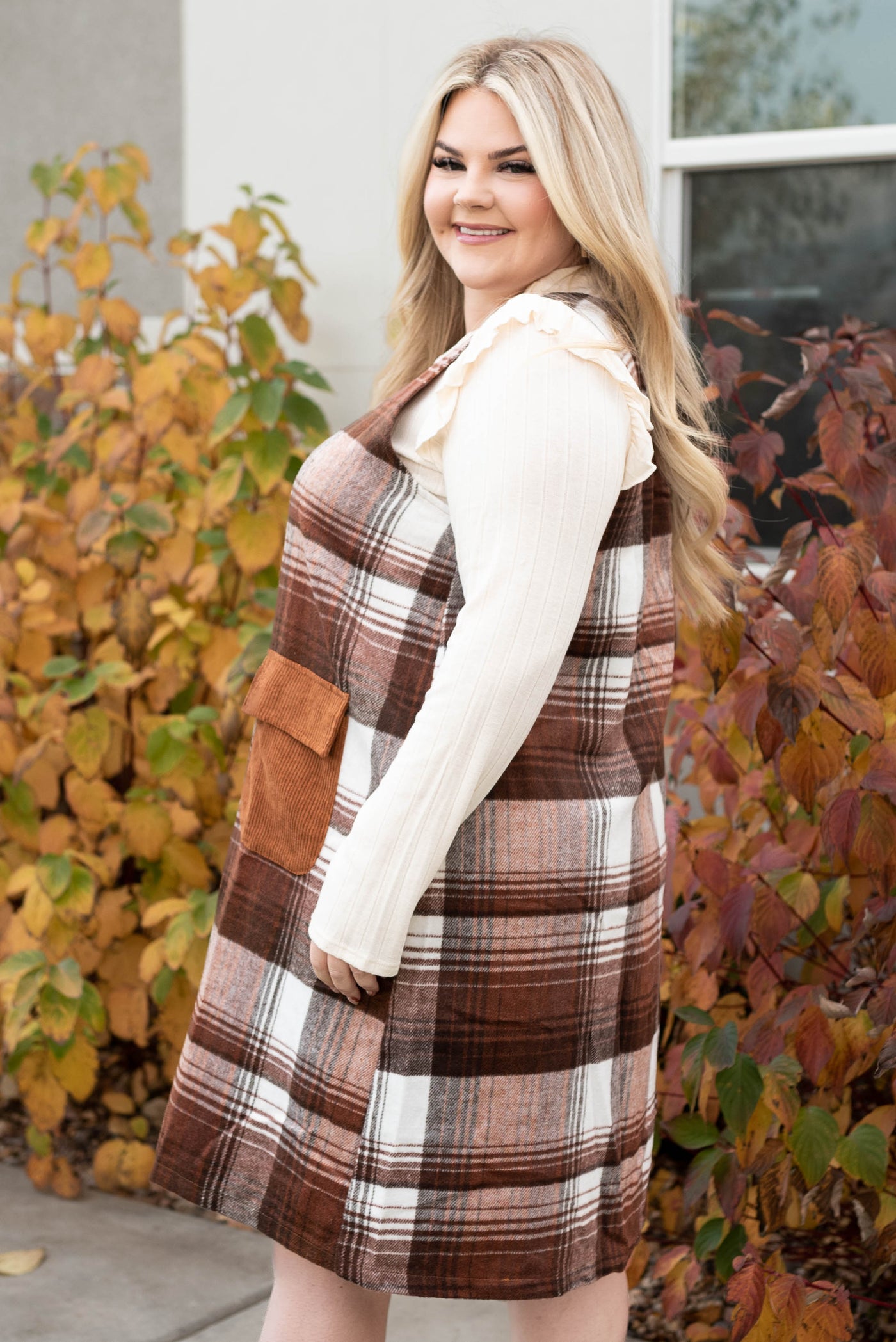 Side view of the plus size brown flannel jumper dress