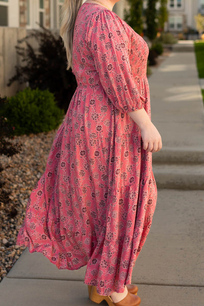Side view of the plus size Audrey red floral dress with tiered skirt