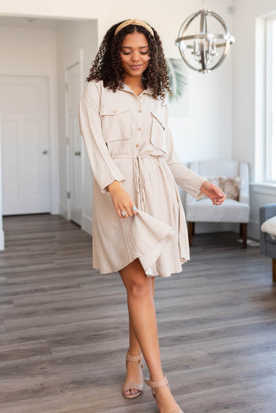 Knee length khaki dress that ties at the waist