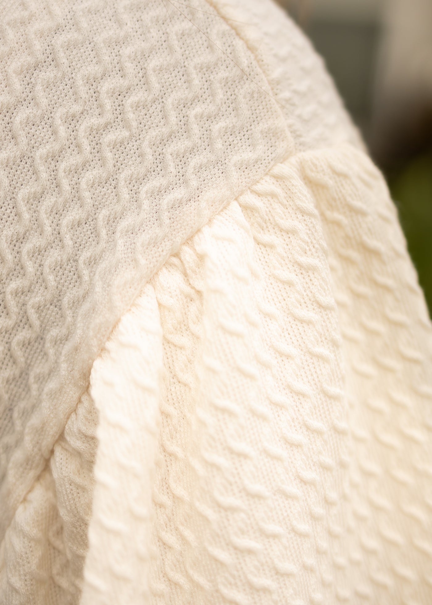 Fabric of a cream textured top
