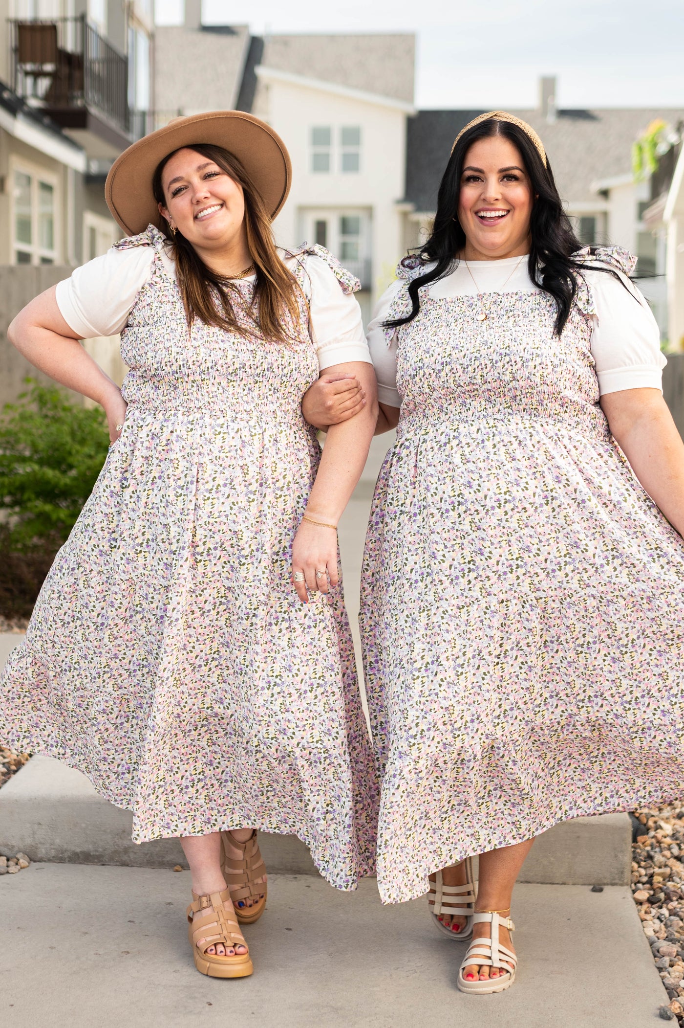 Plus size Lavender small floral sundress with tiered skirt and smocked top paired with a short sleeve white t-shirt.