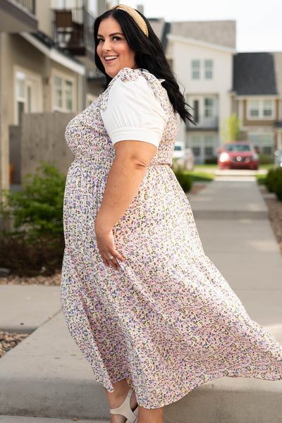 Side view of a plus size Lavender small floral sundress.