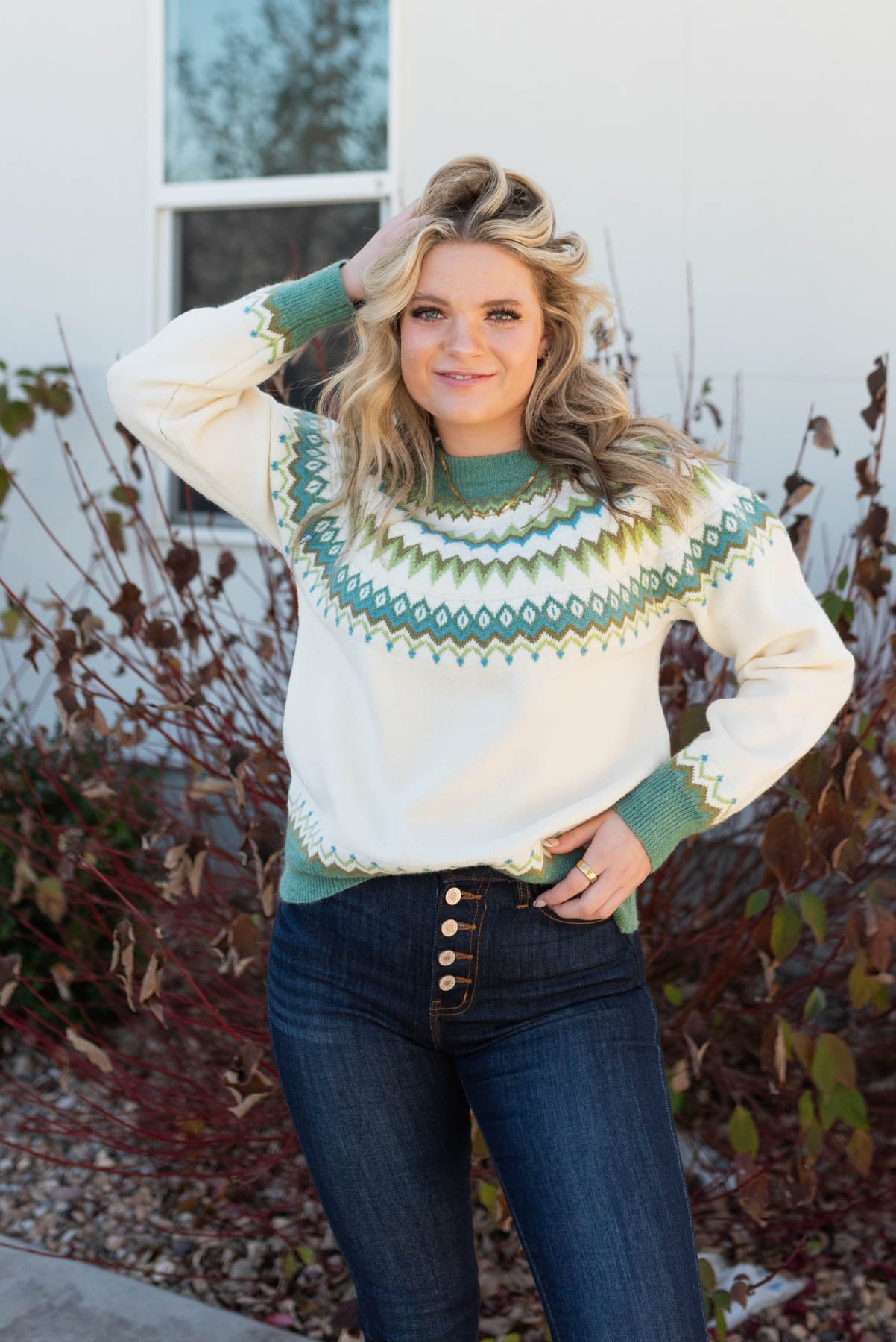 Cream pattern sweater with green collar and cuffs