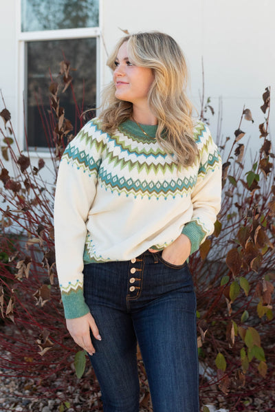 Cream pattern sweater with green designs