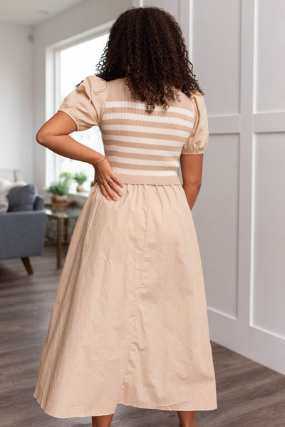 Back view of a sand strip knit dress