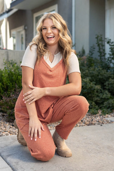 knit rust jumpsuit with pockets