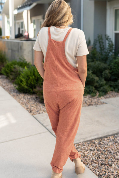 Back view of a rust jumpsuit