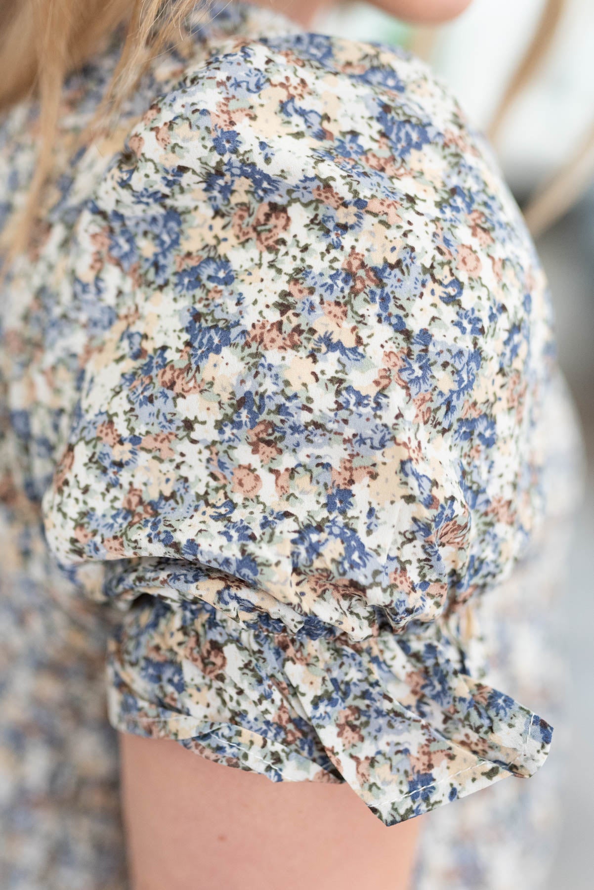Close up of the sleeve on the blue floral dress
