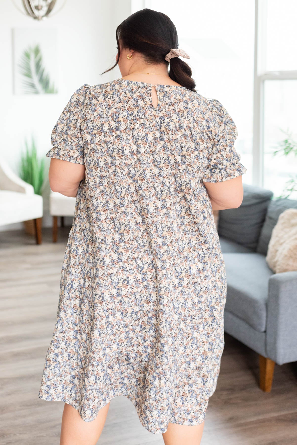 Back view of the plus size blue floral dress