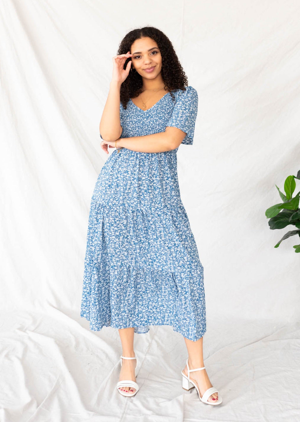 Blue flroal tiered dress with a v-neck 