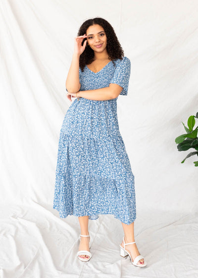 Blue flroal tiered dress with a v-neck 