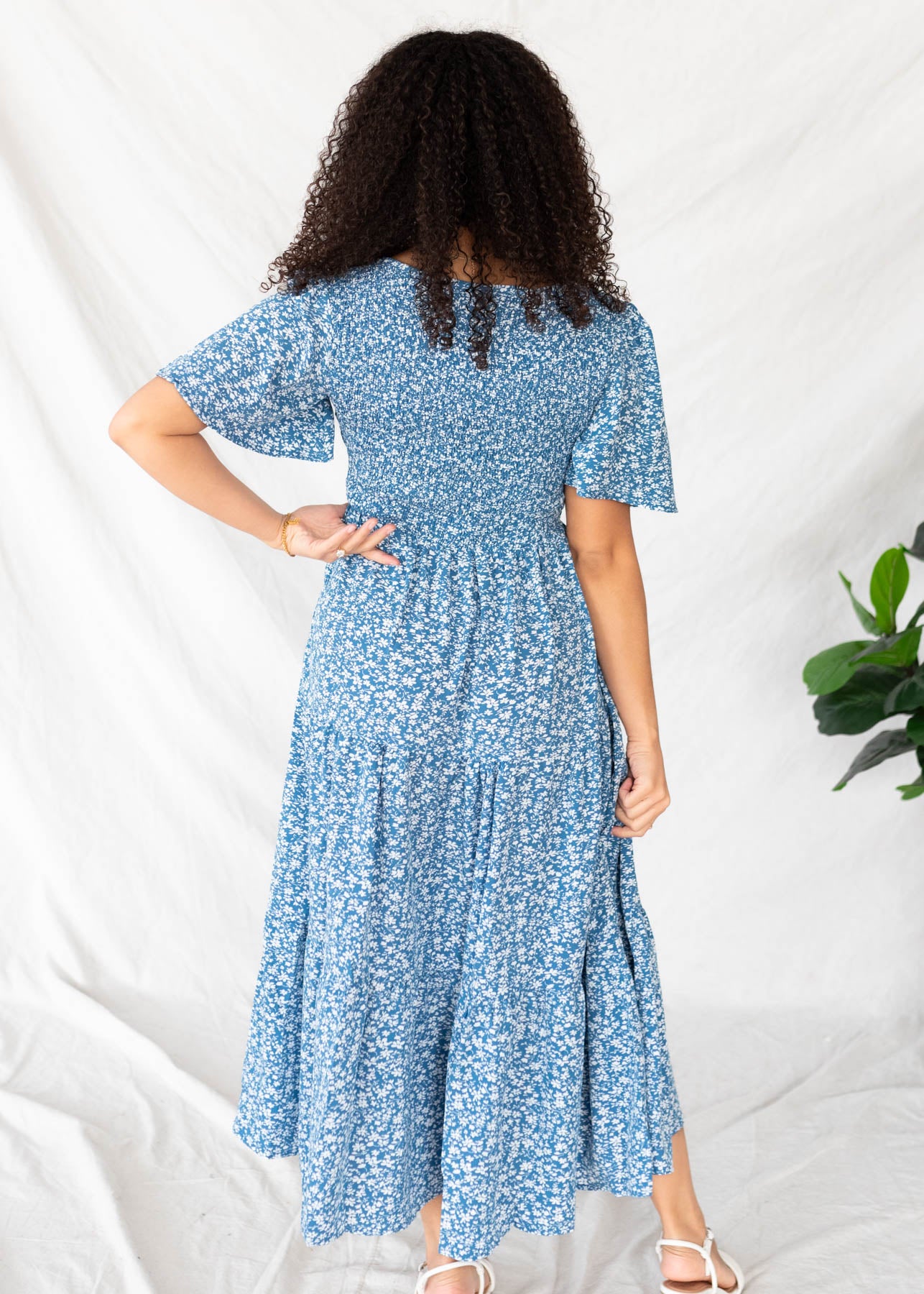Back view of the blue flroal tiered dress
