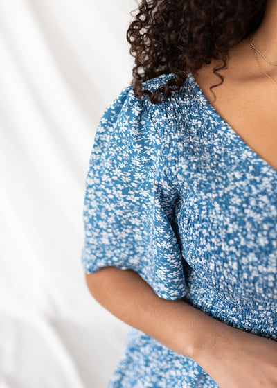 Close up of the fabric on the blue floral tiered dress
