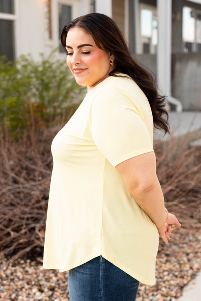 Side view of the plus size yellow top