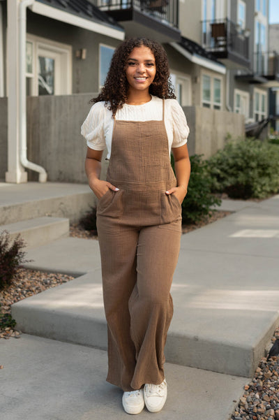 Brown jumpsuit with wide legs and pockets