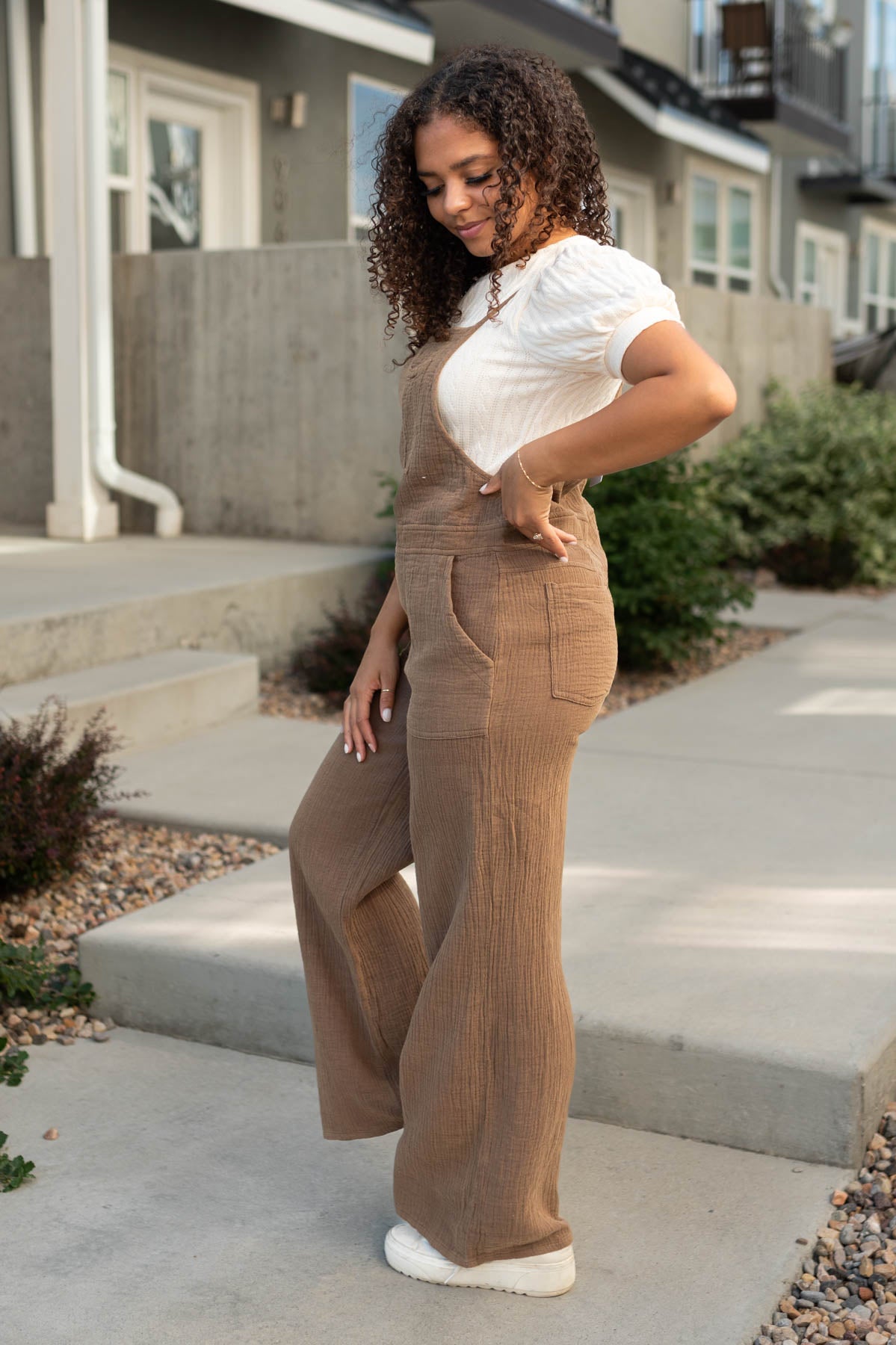 Side view of a brown jumpsuit