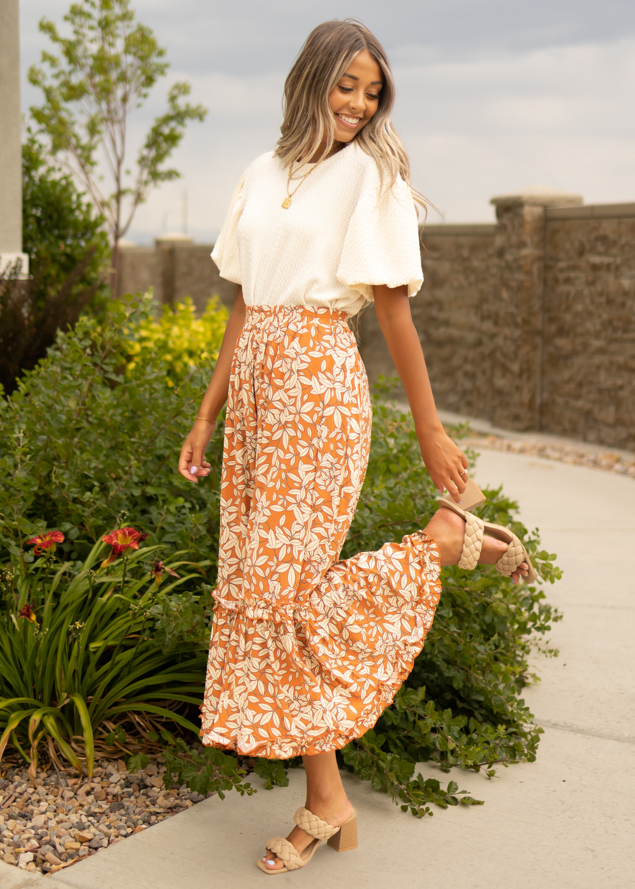 Rust floral skirt with ruffle at the bottom