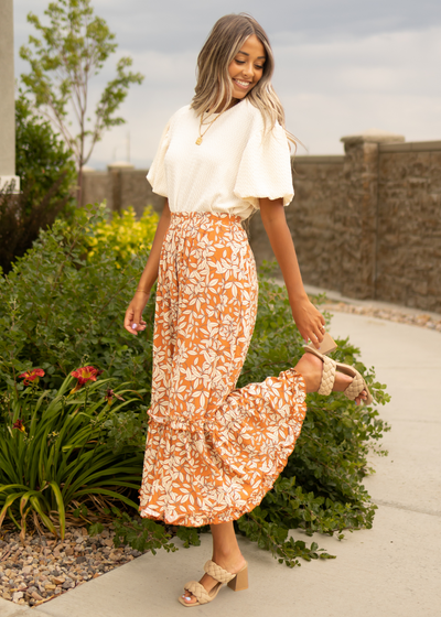 Rust floral skirt with ruffle at the bottom