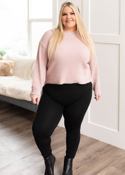Front view of a plus size blush knit sweater