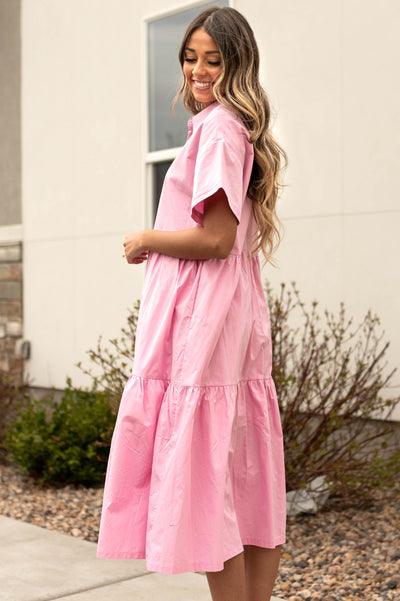 Side view of a strawberry milk pink dress
