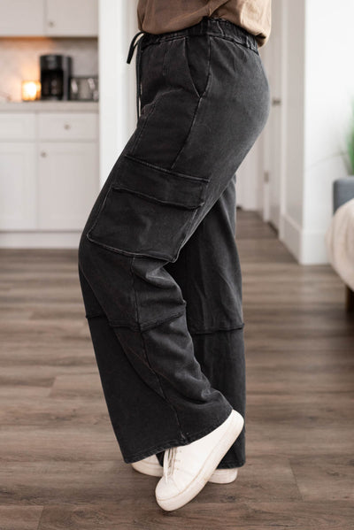 Side view of black pants with side pockets