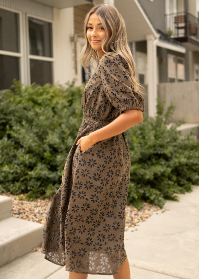 Side view of a mocha gingham dress