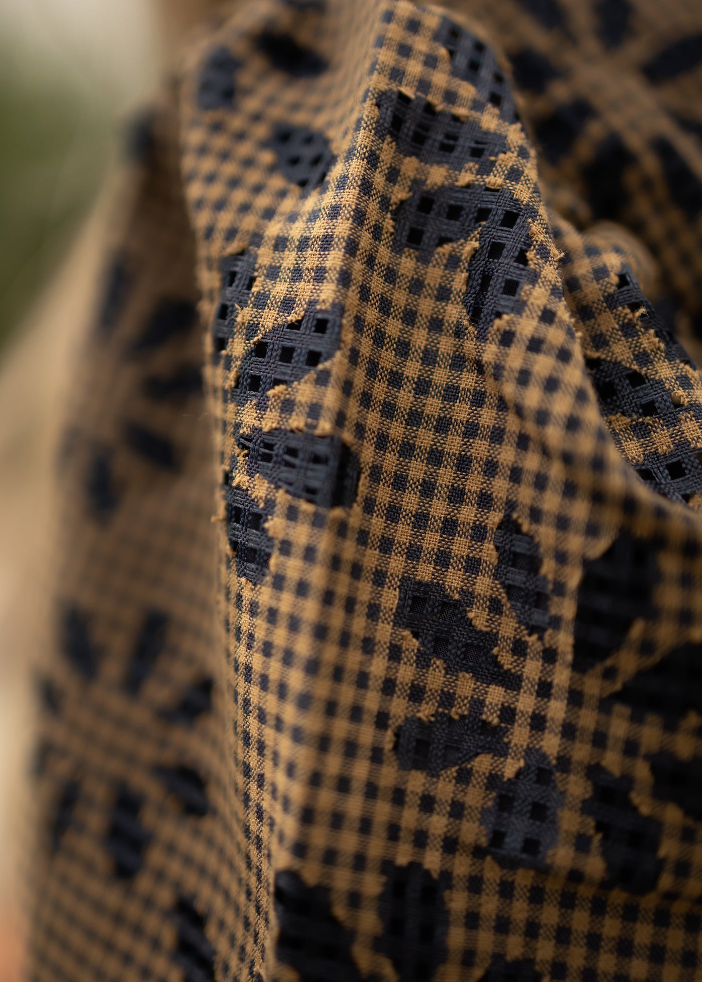 fabric of a mocha gingham dress