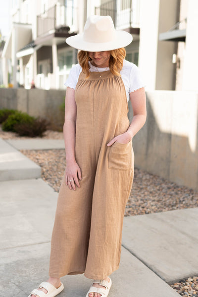 Taupe jumpsuit with pocket and tie in back