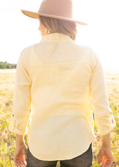 Back view of a yellow top