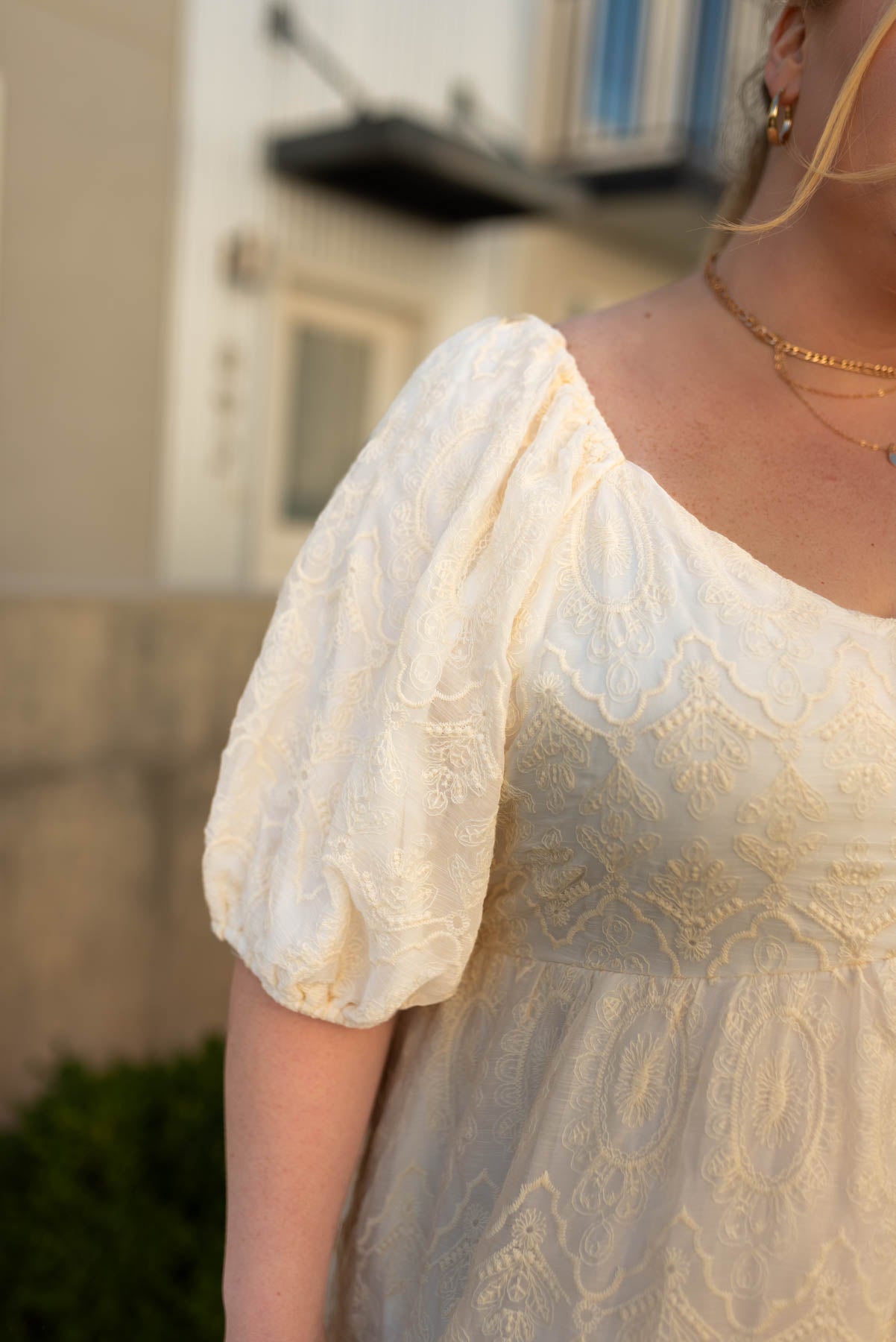 Close up of the neck and sleeve of the natural dress