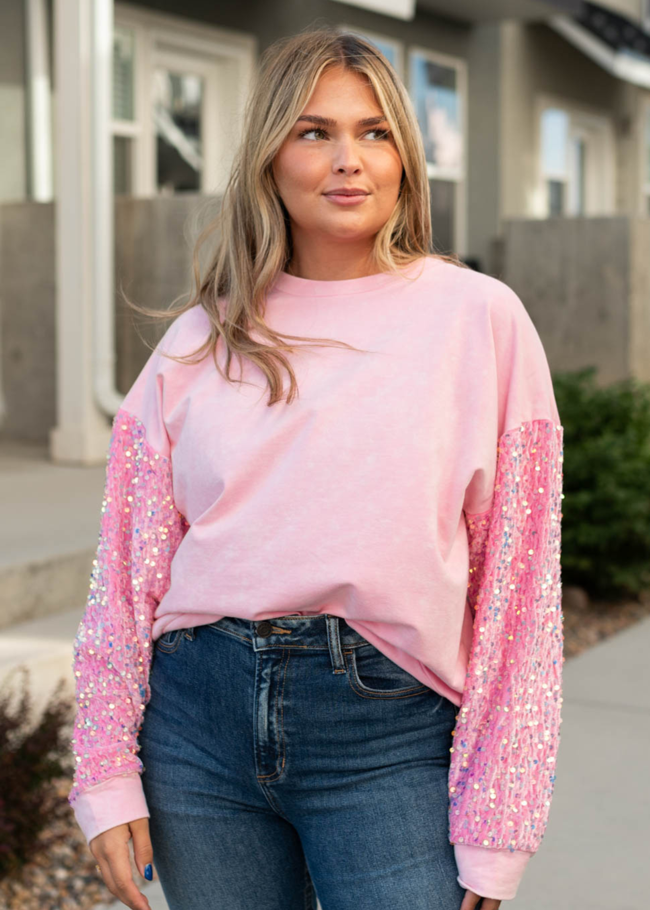 Pink pullover with long sleeves that are sequence