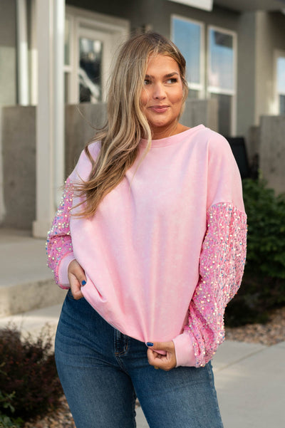 Long sleeve pink pullover with sequence sleeves and drop shoulders