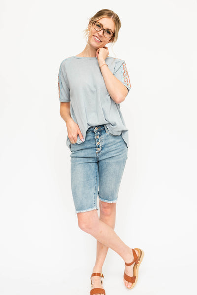 Short sleeve chambray top with embroidery on the sleeves