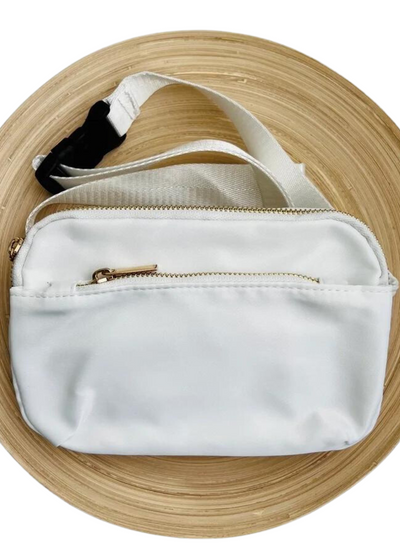 White crossbody fanny pack with zipper pocket