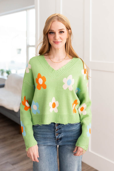 Long sleeve green floral sweater with a v-neck