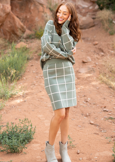 Long sleeve olive plaid sweater with olive plaid skirt
