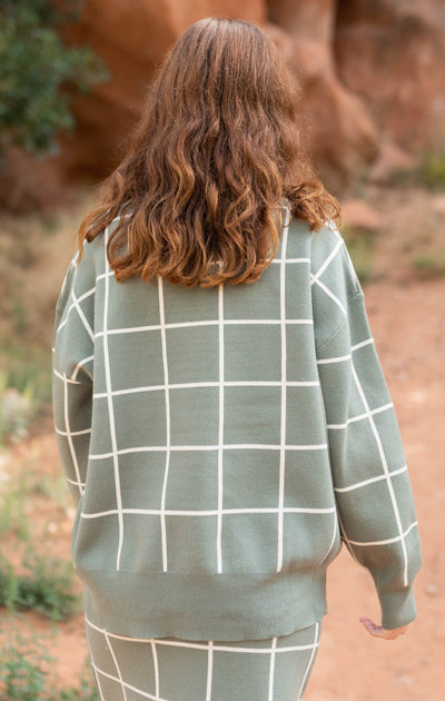 Back view of a olive plaid sweater