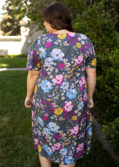 Back view of a plus size navy floral dress