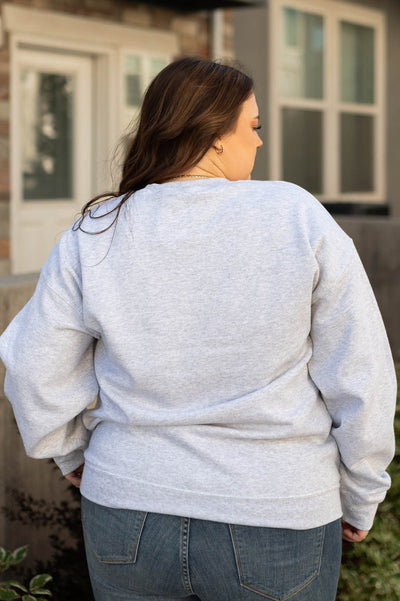 Back view of a plus size boohaw grey sweatshirt