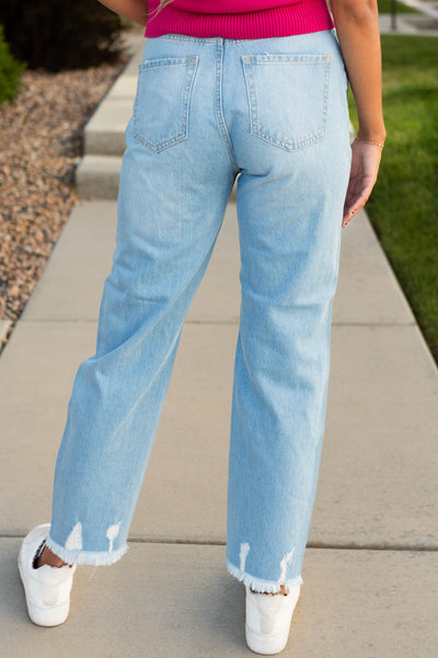 Back view of light high rise distressed mom Jeans