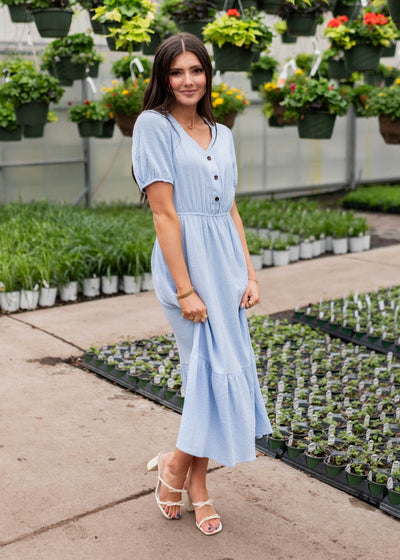 Blue gauze dress with ruffle on hem