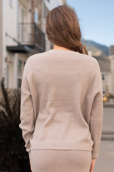 Back view of a stone sweater