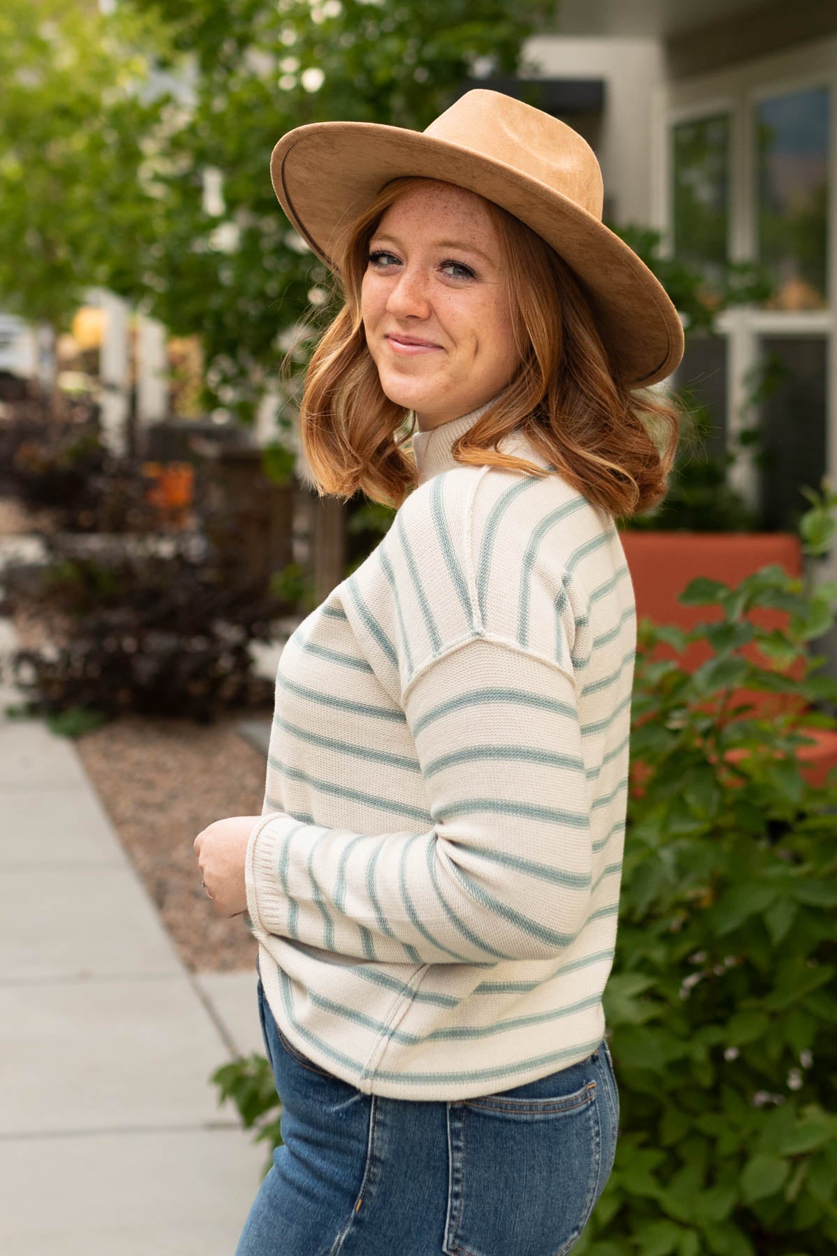Side view of a sage sweater